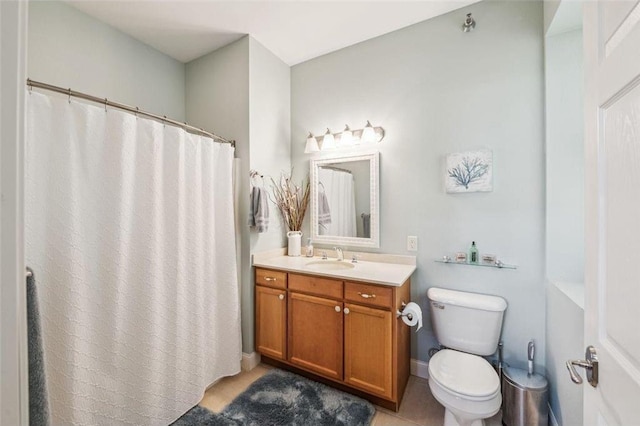 full bath featuring toilet, vanity, and curtained shower