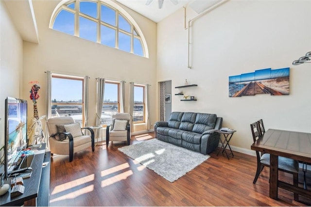 living room with a wealth of natural light and wood finished floors