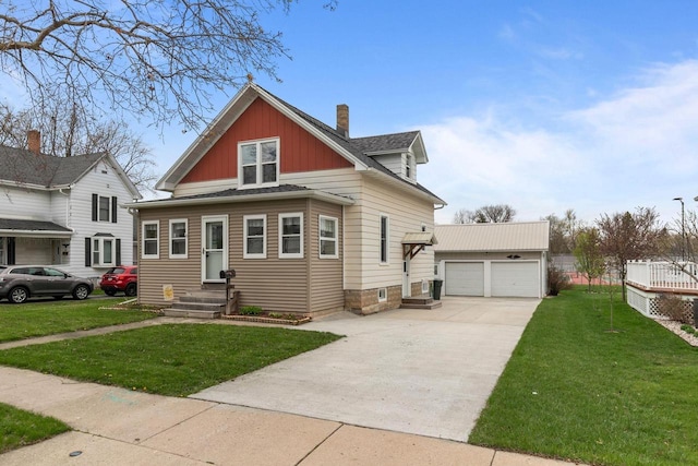bungalow-style home with a chimney, a front yard, an outdoor structure, and a garage