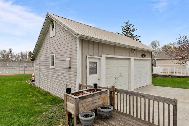 exterior space featuring fence and an outbuilding