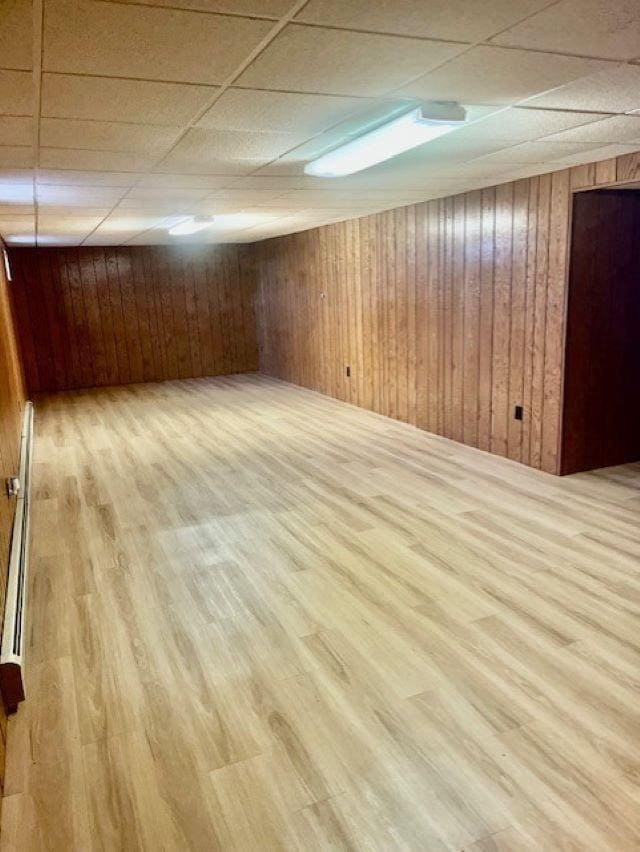 W8918 County Rd W, Crivitz, WI 54114 - finished basement featuring a drop ceiling, wood finished floors, and wooden walls