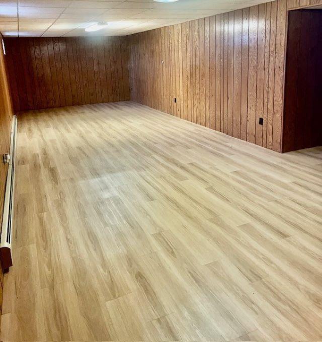 W8918 County Rd W, Crivitz, WI 54114 - finished below grade area featuring wood walls and wood finished floors