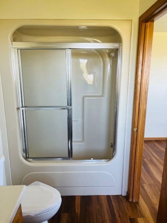 W8918 County Rd W, Crivitz, WI 54114 - full bathroom with wood finished floors, vanity, and toilet