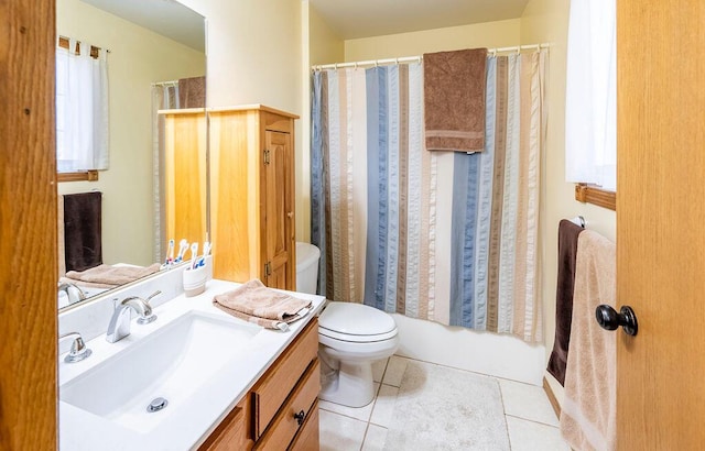 bathroom with vanity, toilet, and tile patterned floors