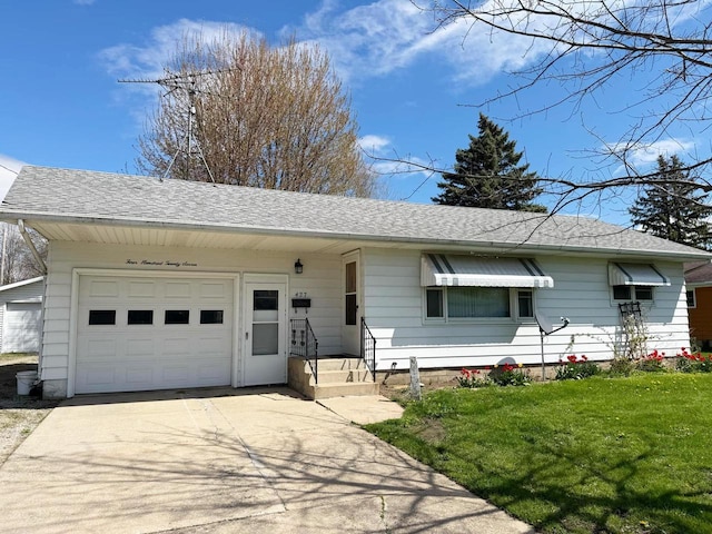 ranch-style home featuring roof with shingles, concrete driveway, an attached garage, and a front yard