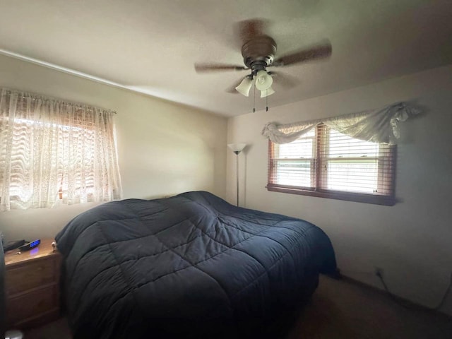 bedroom featuring ceiling fan
