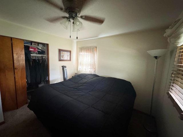 carpeted bedroom featuring a closet and ceiling fan