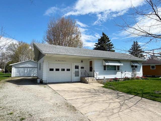 ranch-style home featuring a front yard, roof with shingles, an attached garage, and driveway