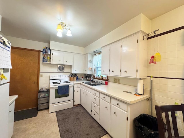 kitchen featuring a sink, open shelves, electric range, white cabinets, and light countertops