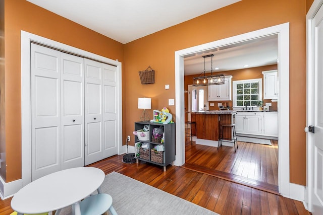 320 W Harrison St, Shullsburg, WI 53586 - interior space featuring baseboards and dark wood-style floors