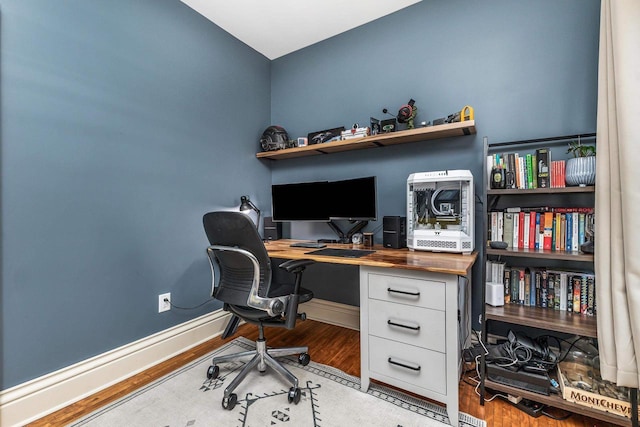 320 W Harrison St, Shullsburg, WI 53586 - office area featuring baseboards and wood finished floors