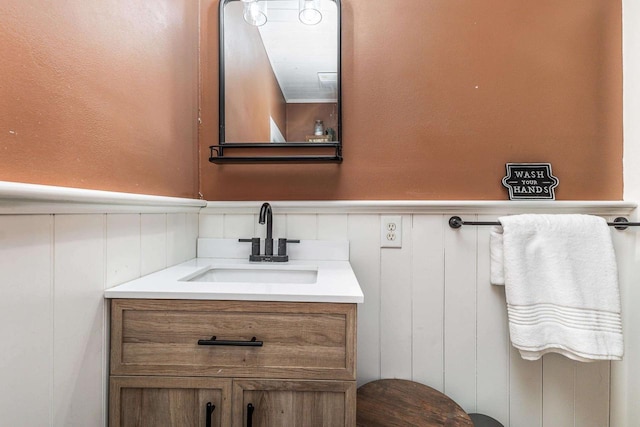320 W Harrison St, Shullsburg, WI 53586 - bathroom featuring vanity, a decorative wall, and a wainscoted wall