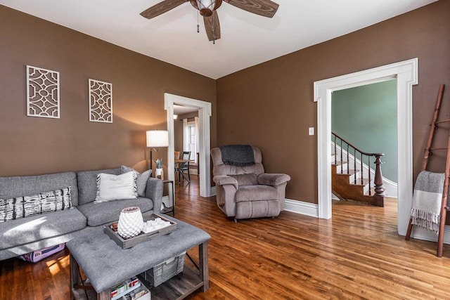 320 W Harrison St, Shullsburg, WI 53586 - living room featuring stairway, baseboards, a ceiling fan, and wood finished floors