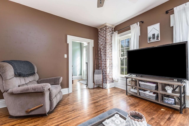 320 W Harrison St, Shullsburg, WI 53586 - living area featuring a ceiling fan, wood finished floors, and baseboards
