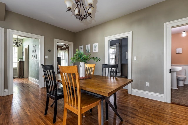 320 W Harrison St, Shullsburg, WI 53586 - dining room featuring a healthy amount of sunlight, an inviting chandelier, and wood finished floors