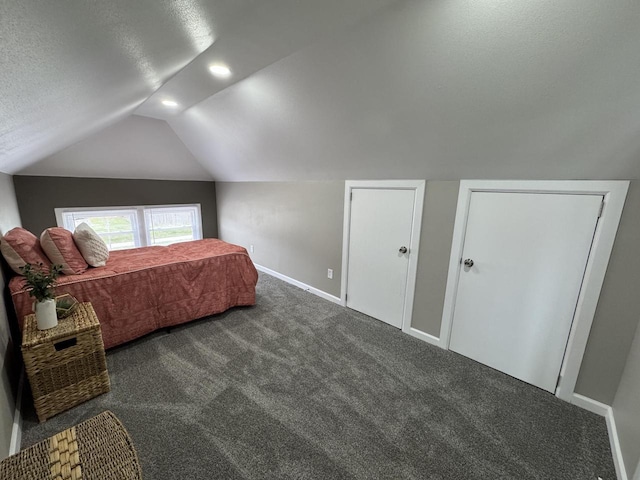 bedroom with lofted ceiling, a textured ceiling, carpet, recessed lighting, and baseboards