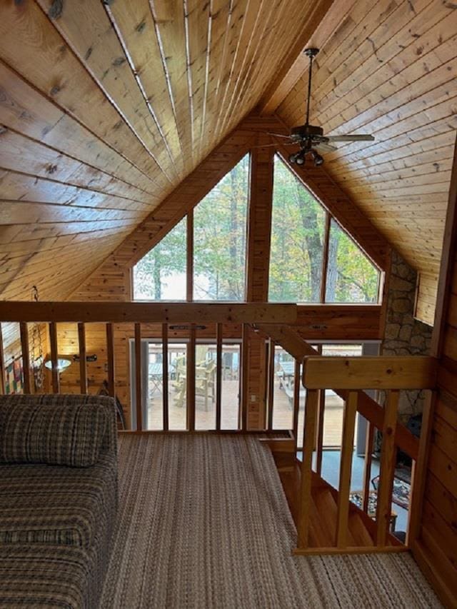 W15560 Mckinley Ln, Athelstane, WI 54104 - living room with high vaulted ceiling, ceiling fan, wooden walls, carpet flooring, and wood ceiling