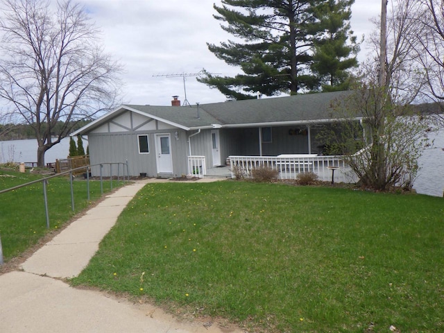 N2646 Rustic Cir, Clintonville, WI 54929 - view of front of property with a porch, board and batten siding, a chimney, and a shingled roof