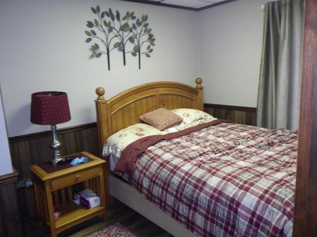 N2646 Rustic Cir, Clintonville, WI 54929 - bedroom with wainscoting, wooden walls, and wood finished floors