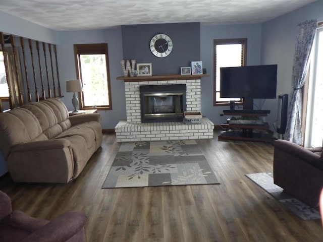 N2646 Rustic Cir, Clintonville, WI 54929 - living area featuring healthy amount of natural light, a brick fireplace, and wood finished floors