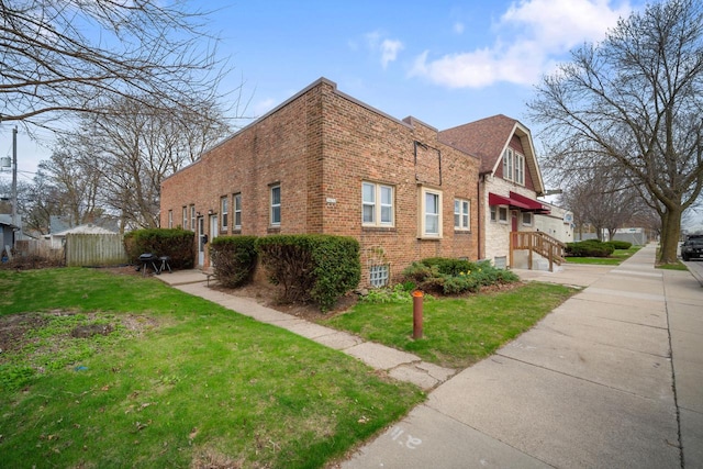 3423 S Clement Ave, Milwaukee, WI 53207 - view of property exterior with an attached garage, brick siding, and a lawn