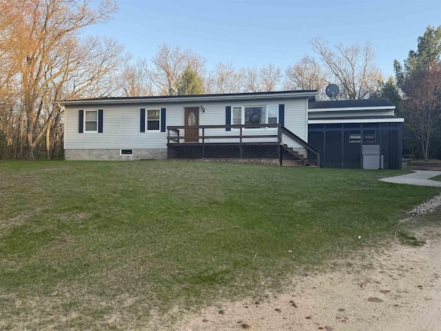 W5417 Volling Ln, Mauston, WI 53948 - back of house with a sunroom, a yard, and a deck