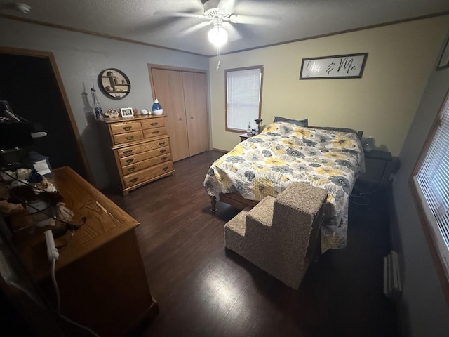 W5417 Volling Ln, Mauston, WI 53948 - bedroom featuring dark wood-style flooring, a closet, and a ceiling fan