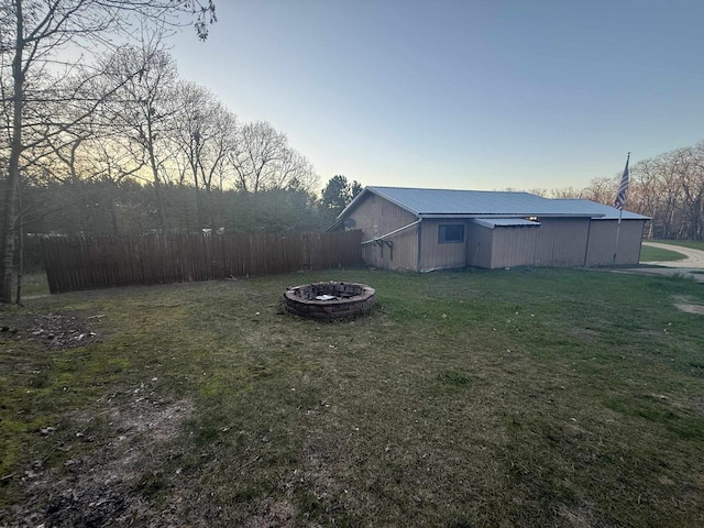 W5417 Volling Ln, Mauston, WI 53948 - view of yard featuring an outdoor fire pit, an outbuilding, and a pole building