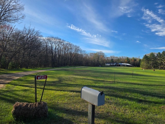 W5417 Volling Ln, Mauston, WI 53948 - view of property's community with a yard
