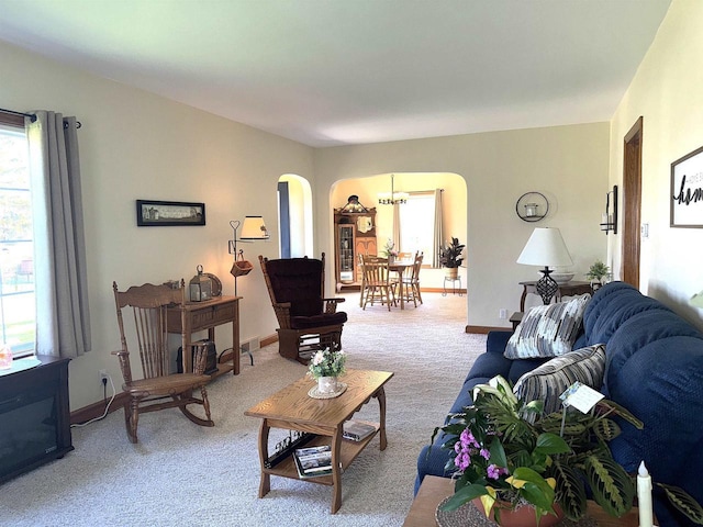 140 W Manchester St, Markesan, WI 53946 - carpeted living area featuring arched walkways and baseboards