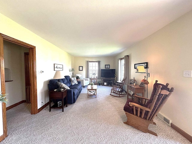 140 W Manchester St, Markesan, WI 53946 - carpeted living room with baseboards and visible vents
