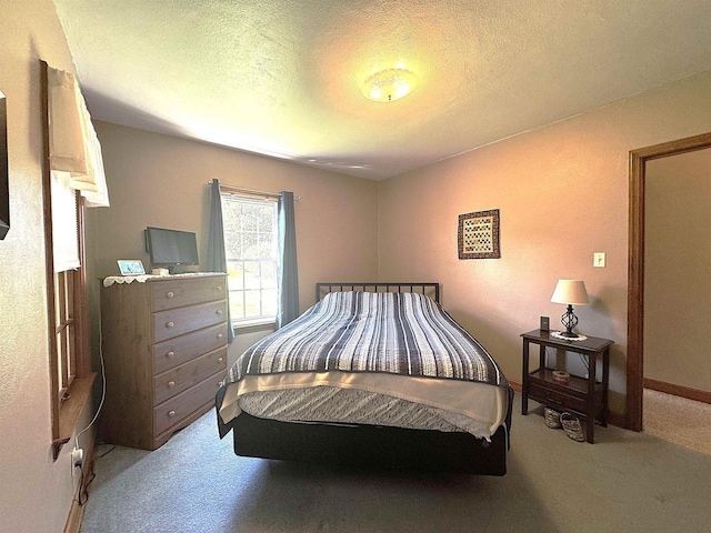 140 W Manchester St, Markesan, WI 53946 - carpeted bedroom featuring a textured ceiling and baseboards