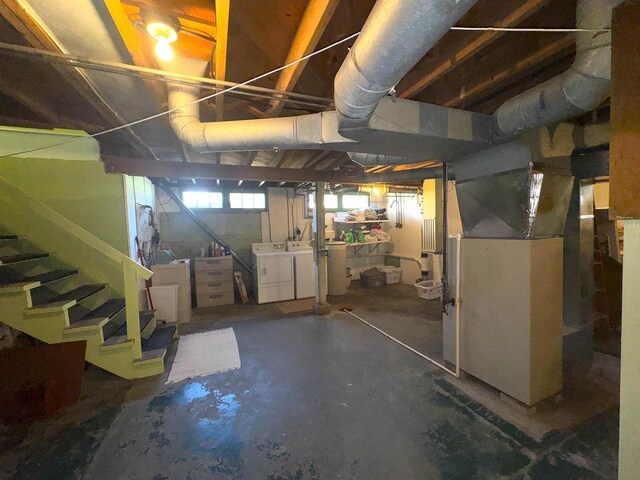 140 W Manchester St, Markesan, WI 53946 - below grade area featuring heating unit, washing machine and clothes dryer, and stairway