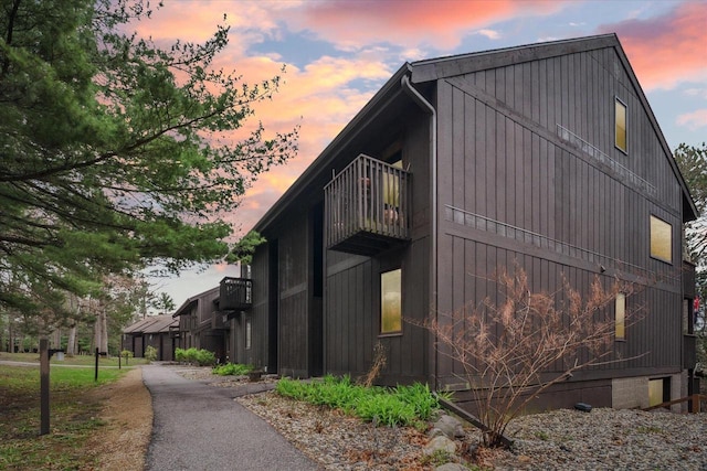 11 Fir Trl, Wisconsin Dells, WI 53965 - property exterior at dusk featuring a balcony