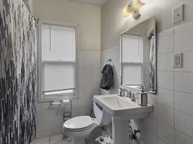 2753 N 60th St Unit 2755, Milwaukee, WI 53210 - bathroom with toilet, tile walls, tile patterned floors, and curtained shower