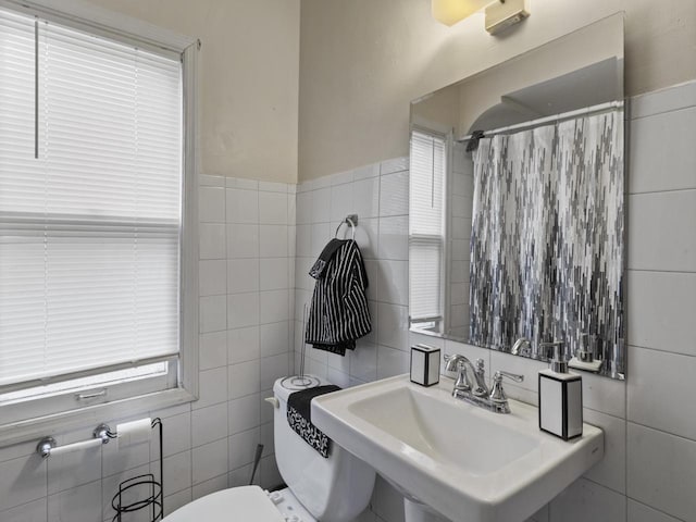 2753 N 60th St Unit 2755, Milwaukee, WI 53210 - full bathroom with toilet, tile walls, a sink, and a shower with shower curtain