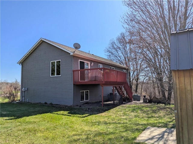 1380 101st Cir, Amery, WI 54001 - back of property featuring stairs, a deck, and a yard
