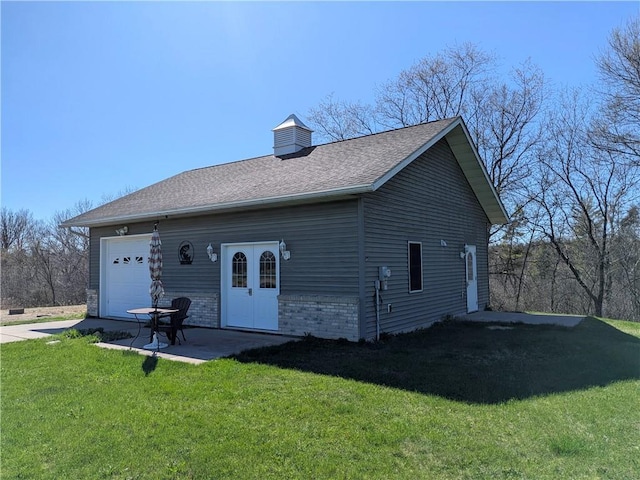 1380 101st Cir, Amery, WI 54001 - view of front of house featuring a front yard, a shingled roof, an attached garage, and concrete driveway