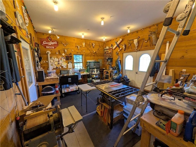 1380 101st Cir, Amery, WI 54001 - living room featuring plenty of natural light, a workshop area, wood walls, and french doors