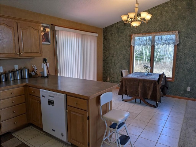 1380 101st Cir, Amery, WI 54001 - kitchen featuring a chandelier, white dishwasher, light tile patterned floors, a peninsula, and dark countertops