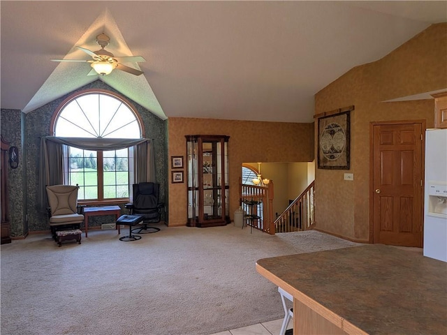 1380 101st Cir, Amery, WI 54001 - living area with vaulted ceiling, an upstairs landing, wallpapered walls, carpet floors, and ceiling fan