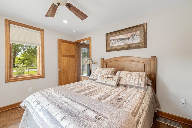 1430 Park Ave, West Bend, WI 53090 - bedroom with baseboards, wood finished floors, ceiling fan, and recessed lighting