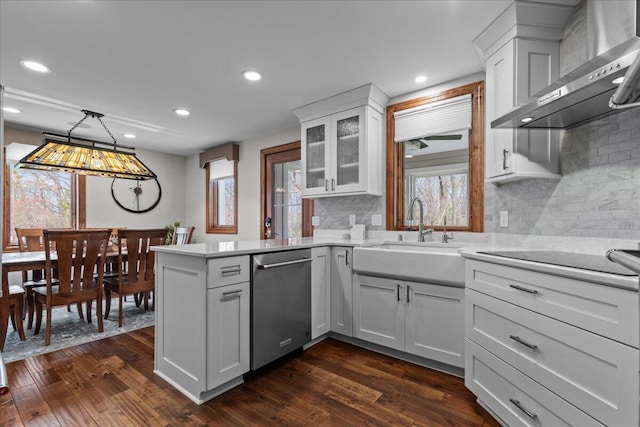 1430 Park Ave, West Bend, WI 53090 - kitchen with dishwasher, wall chimney exhaust hood, a sink, black electric stovetop, and a peninsula