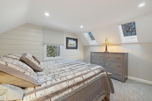 1430 Park Ave, West Bend, WI 53090 - bedroom featuring a skylight, vaulted ceiling, baseboards, recessed lighting, and light carpet