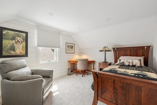 1430 Park Ave, West Bend, WI 53090 - bedroom with vaulted ceiling, light carpet, and wooden walls