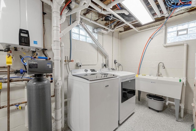 1430 Park Ave, West Bend, WI 53090 - washroom with washer and clothes dryer, concrete block wall, and water heater