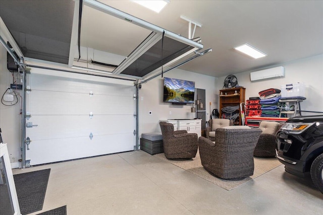 1430 Park Ave, West Bend, WI 53090 - garage featuring a wall unit AC
