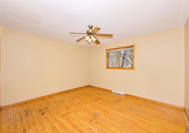 7113 E County Rd E, South Range, WI 54874 - spare room with ceiling fan, baseboards, and light wood-type flooring