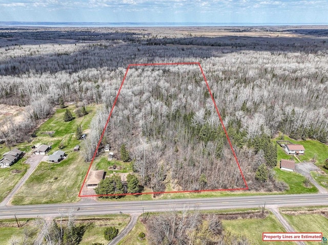 7113 E County Rd E, South Range, WI 54874 - aerial view of property's location with property parcel outlined and a forest