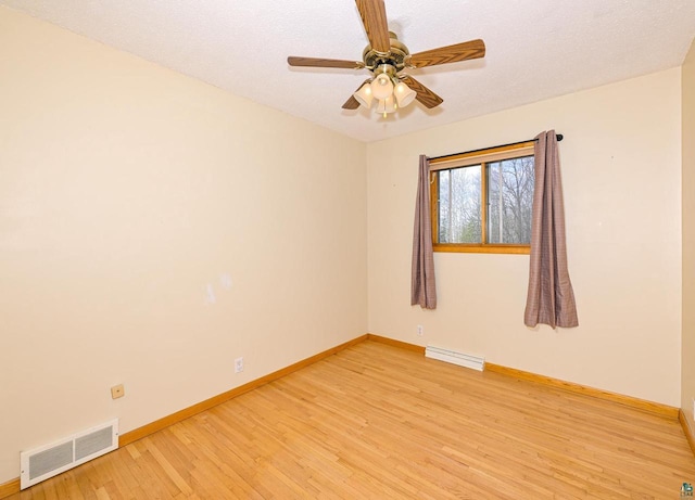 7113 E County Rd E, South Range, WI 54874 - spare room with light wood finished floors, baseboards, and ceiling fan